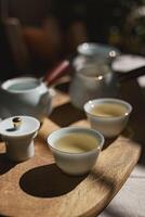 An Exquisite Tea Set Display with Beautifully Crafted Cups and an Elegant Teapot photo