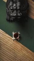 Cultural decoration with a Chinese Guardian Lion and a traditional tea set for ambiance photo