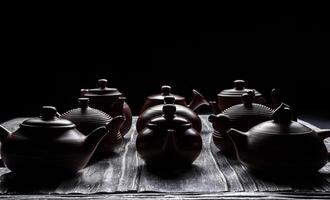 An Artistic and Captivating Display of Traditional Teapots Presented in Low Light Conditions photo