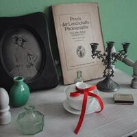An exquisite vintage still life arrangement featuring an array of charming retro elements photo