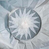 This is an intricate circular pattern featuring a stunning star design that captivates photo