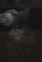 Exploring Abstract Smoke Patterns Created Within a Dark and Enigmatic Atmosphere photo