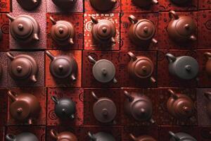 Artistic and Unique Arrangement of Traditional Tea Pots for an Inviting Aesthetic Display photo