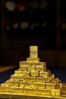 A Spectacular Golden Pyramid Built from Glimmering Bullion Bars Symbolizing Wealth and Prosperity photo
