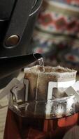 Brewing an Exquisite Cup of Coffee Using the Pour Over Method in a Cozy Kitchen Atmosphere photo