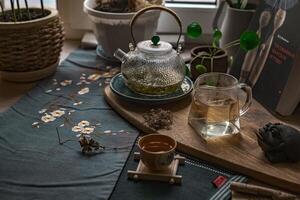 Experience Serene Tea Time A Cozy, Inviting Tea Setup Adorned with Beautiful Greenery photo