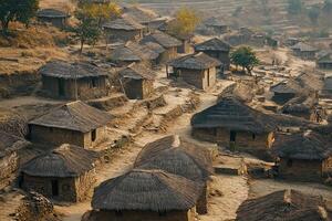Aerial view of a rural village with traditional mud and thatch houses. photo