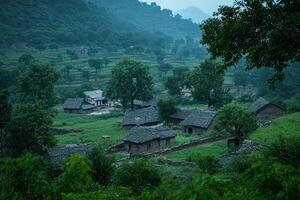 Misty mountain village with traditional houses and lush green fields. photo