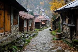Cobblestone street in a historic mountain village on an autumn day. photo