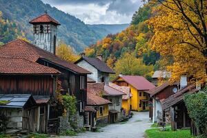 Charming autumn village nestled in a valley, colorful houses, foliage. photo