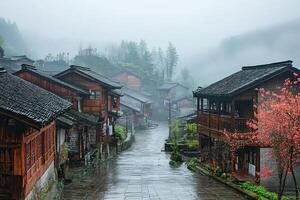 Misty mountain village street with traditional wooden houses. photo