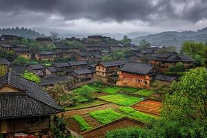 Misty mountain village with traditional houses and terraced fields. photo