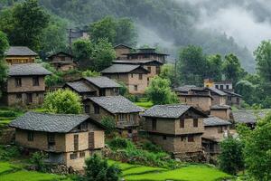 Misty mountain village with traditional stone houses and terraced rice fields. photo