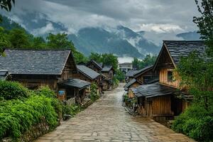 Stone path leads through quaint wooden houses nestled in misty mountains. photo