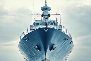 A large ship facing forward under a cloudy sky. photo