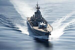 A battleship navigating through calm waters. photo