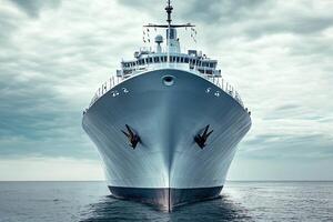 A large ship anchored in calm waters under a cloudy sky. photo