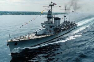 A battleship sailing on calm waters, displaying flags. photo