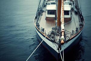 A close-up view of a sailing ship on calm waters. photo