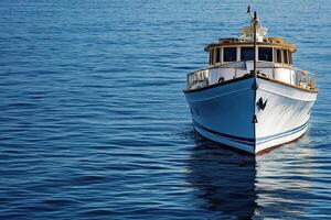 A boat navigating calm waters under a clear sky. photo