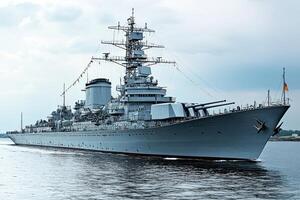 A large battleship sailing through calm waters. photo