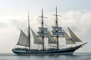 A majestic sailing ship with multiple masts at sea. photo