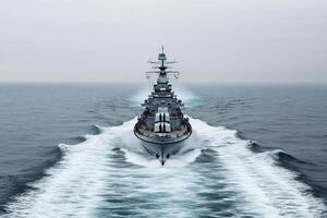 A battleship navigating through the ocean waters. photo