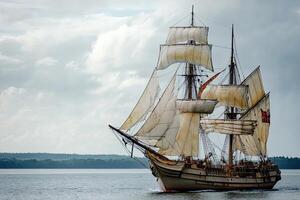 A majestic sailing ship navigating calm waters. photo