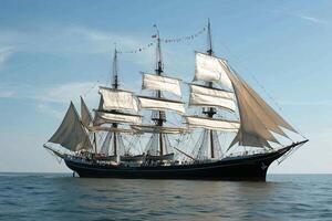 A majestic sailing ship navigating calm waters. photo