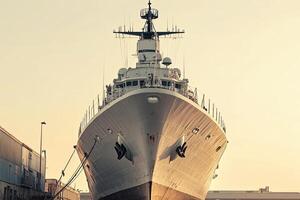 Large ship docked, showcasing naval architecture. photo