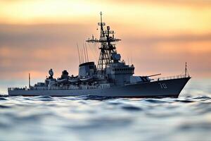 Naval warship sailing at sunset over calm waters. photo