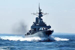 Naval ship navigating through ocean waters. photo