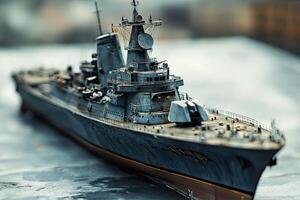 Detailed model of a battleship on a textured surface. photo