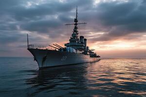 Battleship anchored at sunset on calm waters. photo
