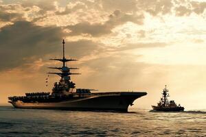 Naval ships in silhouette during sunset. photo