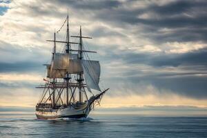 Sailing ship gliding through calm waters under cloudy sky. photo