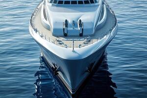 Sleek yacht bow gliding over calm water surface. photo