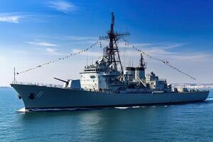 Naval ship sailing with flags in a clear blue sea. photo