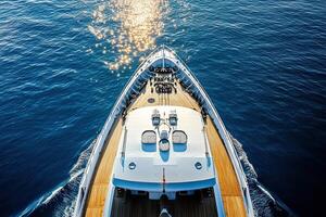Aerial view of a yacht cutting through sparkling water. photo