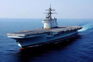Aircraft carrier navigating through open waters. photo