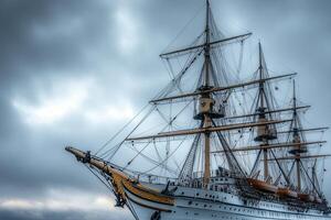 Historic sailing ship under cloudy sky. photo