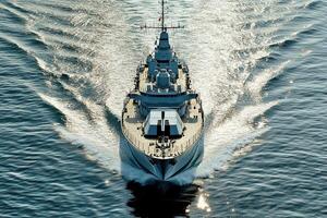 Naval ship navigating through calm waters. photo