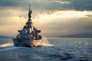 Naval ship navigating through calm waters at sunset. photo