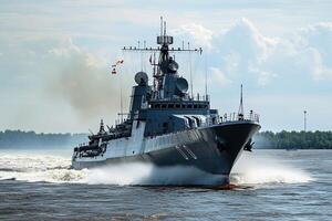 Naval ship navigating through water with smoke and flags. photo