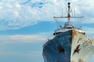 Rusty ship bow against a cloudy sky. photo