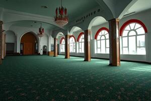 Empty mosque interior with arched windows, green carpet, and chandelier. photo