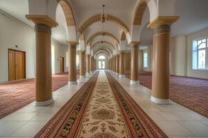 Interior of a mosque with arched hallways, columns, and ornate carpets. photo
