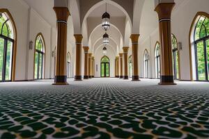 Grand mosque interior, featuring high arched ceilings, wooden columns, patterned carpet, and large windows. photo