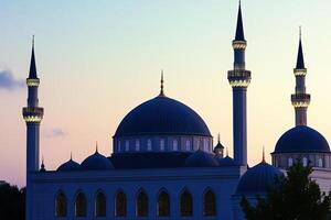 Majestic mosque at sunset, showcasing architectural details and serene twilight ambiance. photo