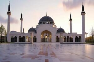 Majestic mosque at sunset, showcasing architectural details and tranquil courtyard. photo